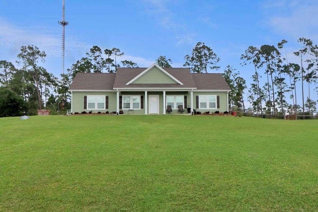6.19 Acres of Land with Home for Sale in Wewahitchka, Florida