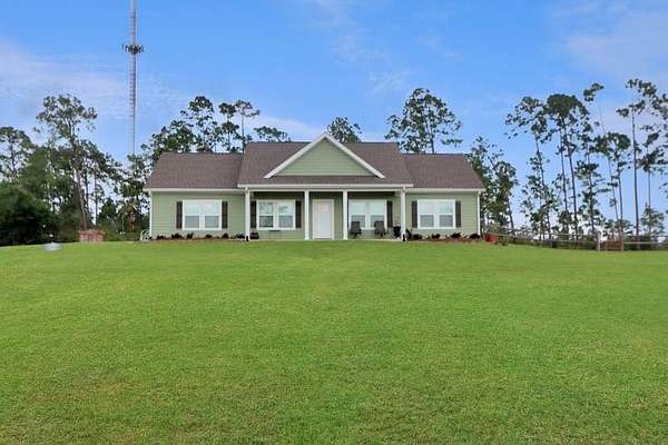 6.19 Acres of Land with Home for Sale in Wewahitchka, Florida