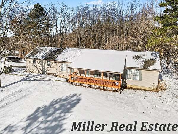 5 Acres of Land with Home for Sale in Delton, Michigan