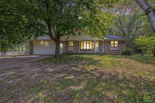 4 Acres of Residential Land with Home for Sale in Rockford, Michigan