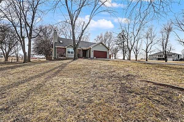 3.79 Acres of Residential Land with Home for Sale in Raymore, Missouri