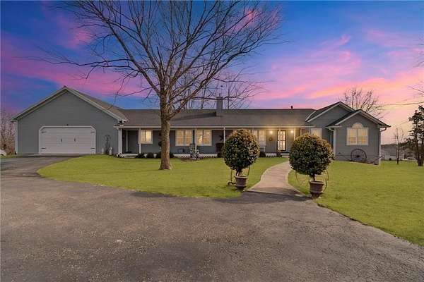 4.48 Acres of Residential Land with Home for Sale in Cameron, Missouri