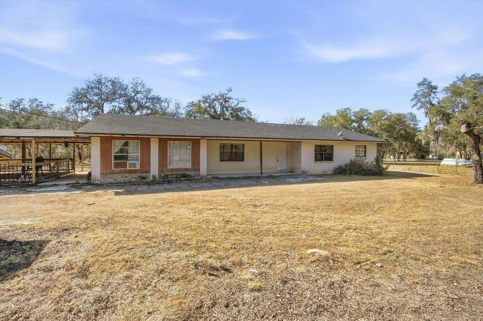 2.23 Acres of Residential Land with Home for Sale in Polk City, Florida