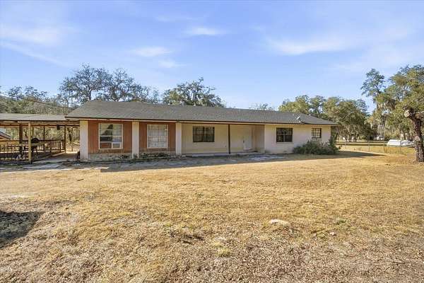 2.23 Acres of Residential Land with Home for Sale in Polk City, Florida