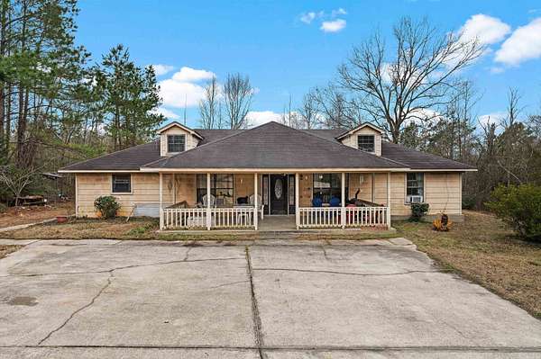 37.8 Acres of Agricultural Land with Home for Sale in Timpson, Texas