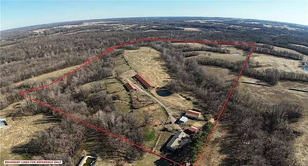 99.4 Acres of Land with Home for Sale in Gravette, Arkansas