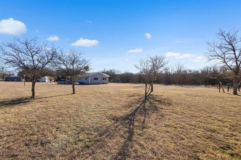 1.66 Acres of Land with Home for Sale in Runaway Bay, Texas
