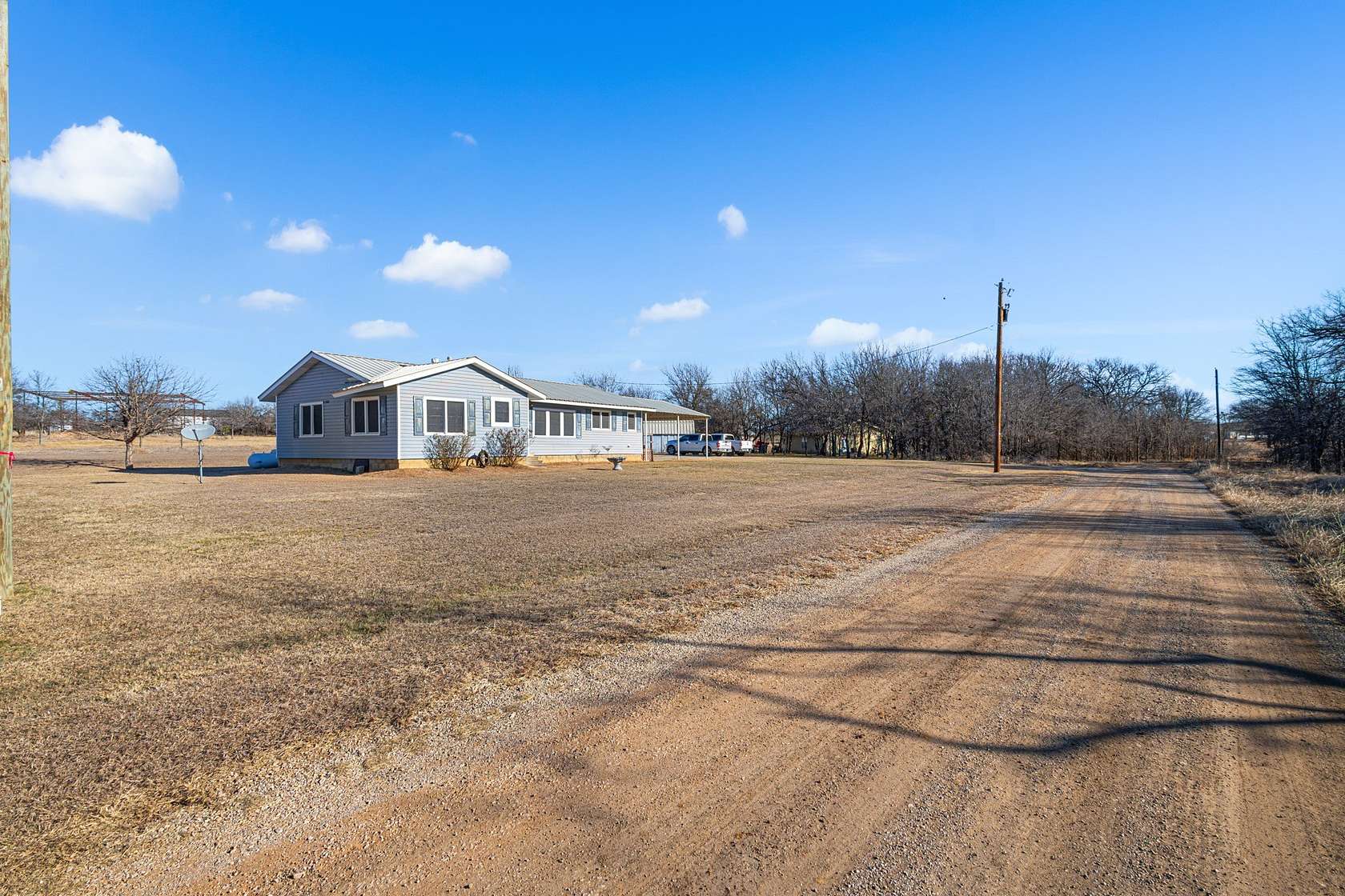 1.66 Acres of Land with Home for Sale in Runaway Bay, Texas