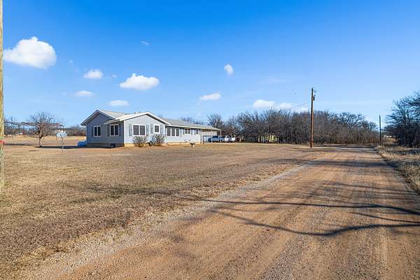1.66 Acres of Land with Home for Sale in Runaway Bay, Texas
