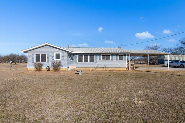 1.66 Acres of Land with Home for Sale in Runaway Bay, Texas