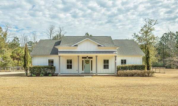 5 Acres of Residential Land with Home for Sale in Crawfordville, Florida