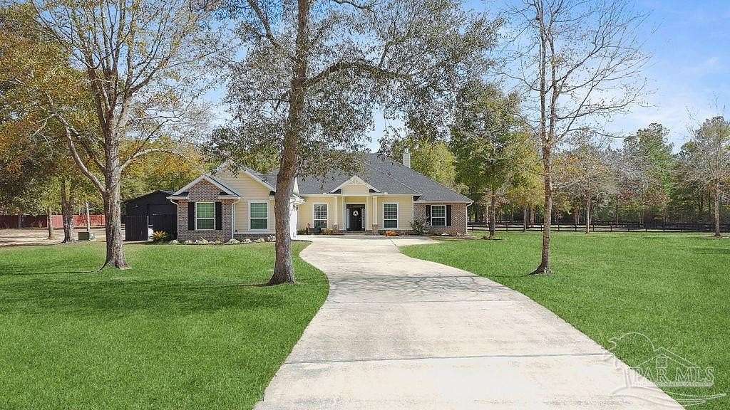 4 Acres of Residential Land with Home for Sale in Pace, Florida