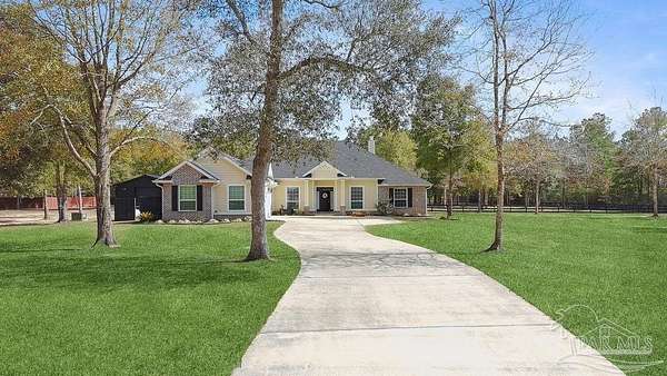 4 Acres of Residential Land with Home for Sale in Pace, Florida