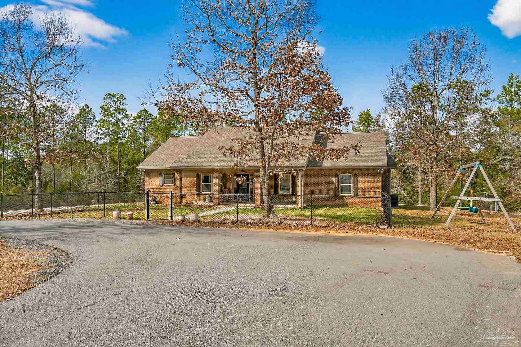 11.7 Acres of Land with Home for Sale in Pace, Florida