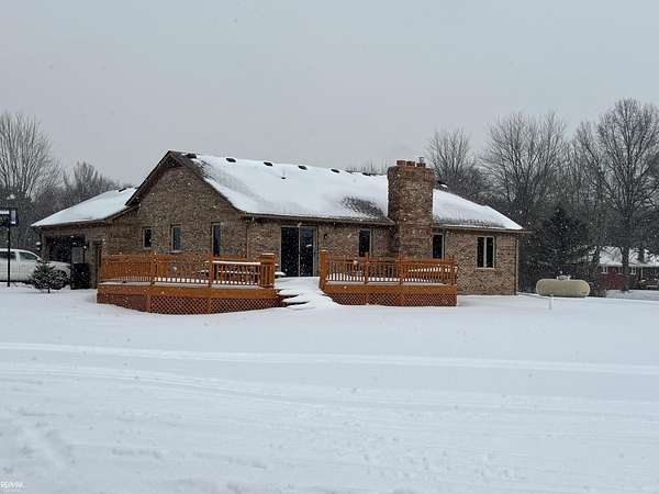 5.53 Acres of Residential Land with Home for Sale in Casco, Michigan