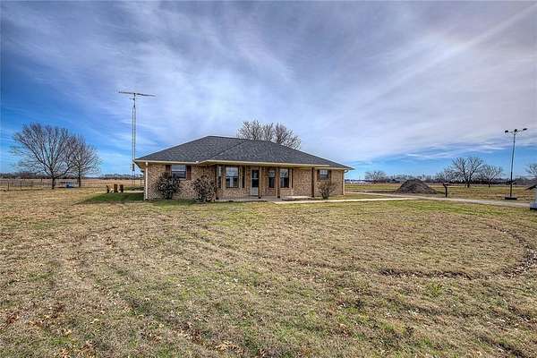 2.48 Acres of Residential Land with Home for Sale in Commerce, Texas