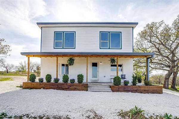 30.6 Acres of Agricultural Land with Home for Sale in Springtown, Texas