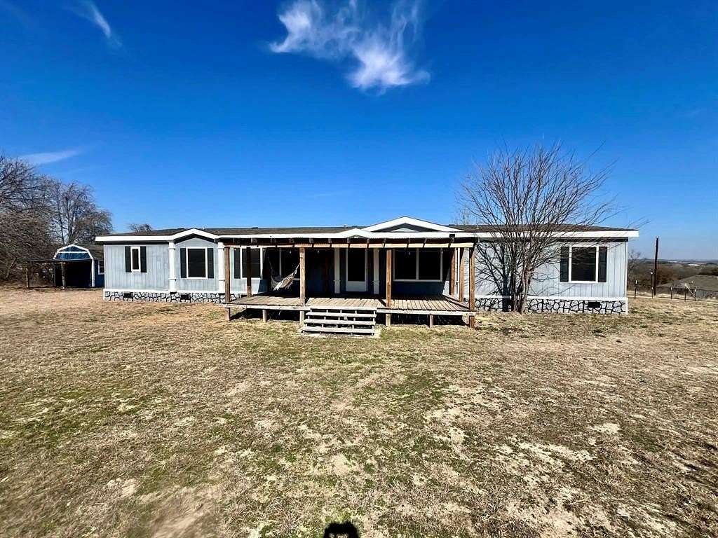 5 Acres of Residential Land with Home for Sale in Springtown, Texas