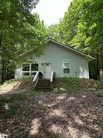 5 Acres of Land with Home for Sale in South Boardman, Michigan
