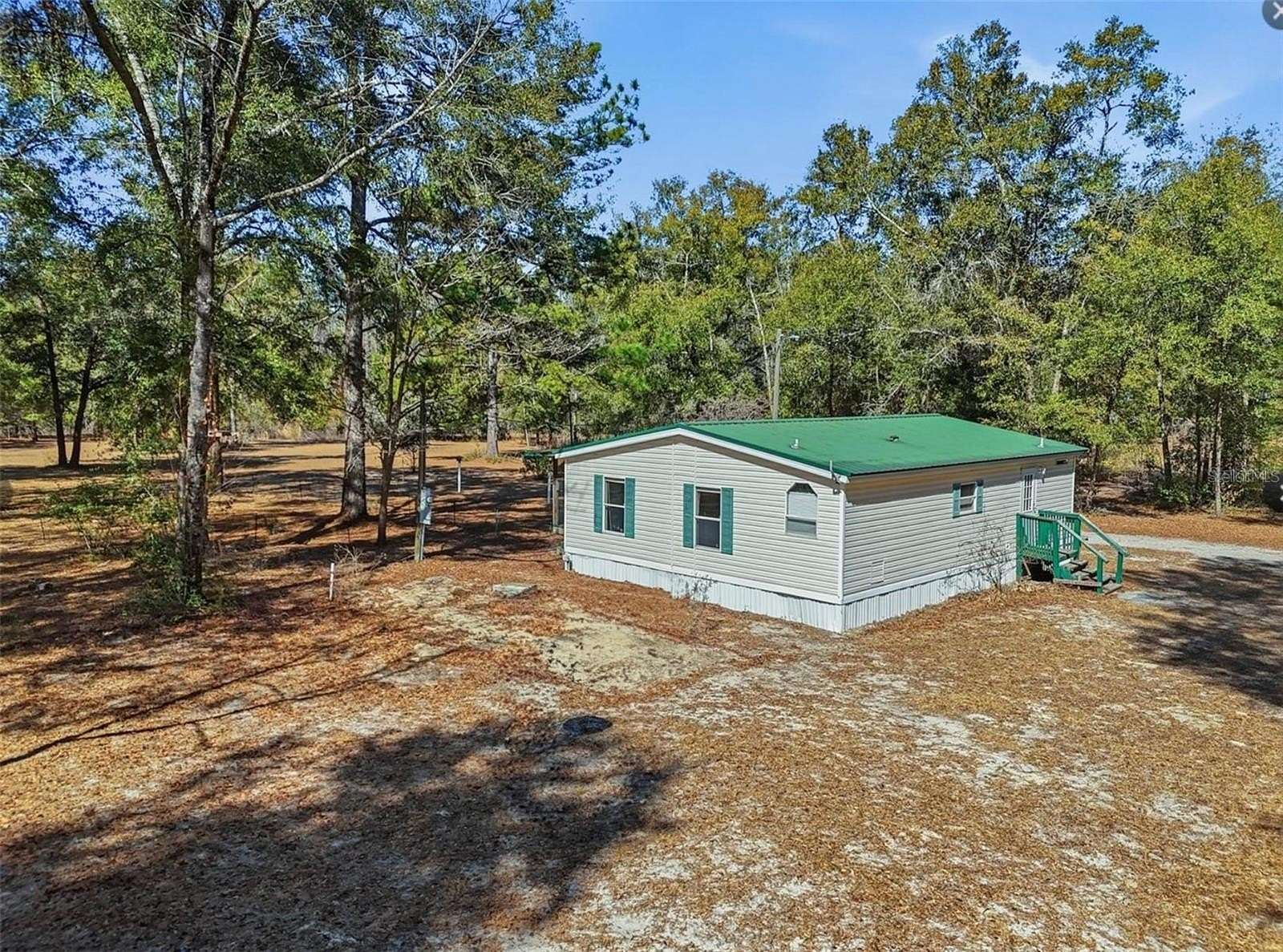 5.12 Acres of Residential Land with Home for Sale in Fort White, Florida