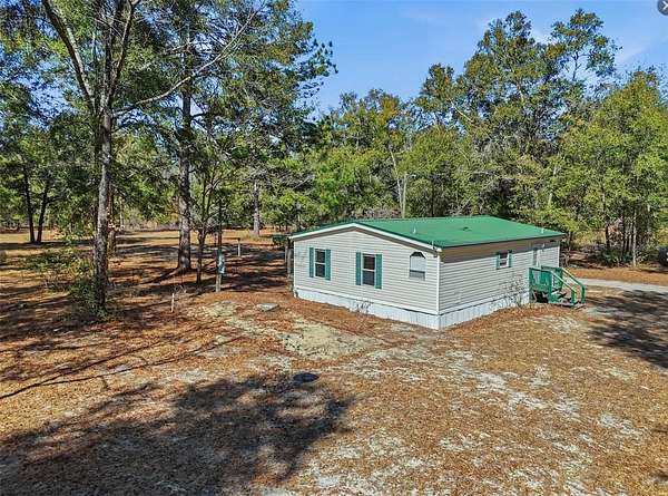 5.12 Acres of Residential Land with Home for Sale in Fort White, Florida