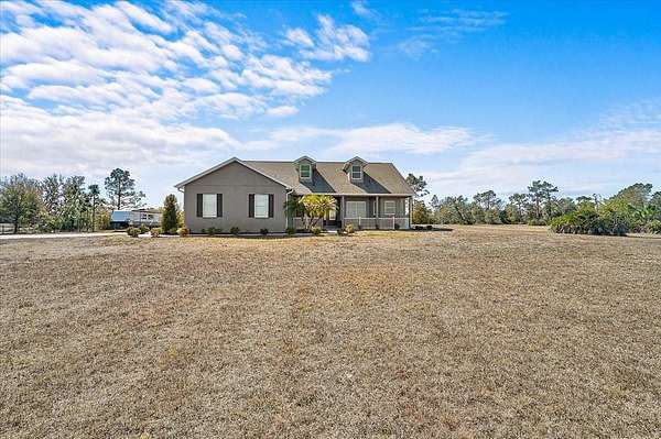 5.39 Acres of Land with Home for Sale in Myakka City, Florida