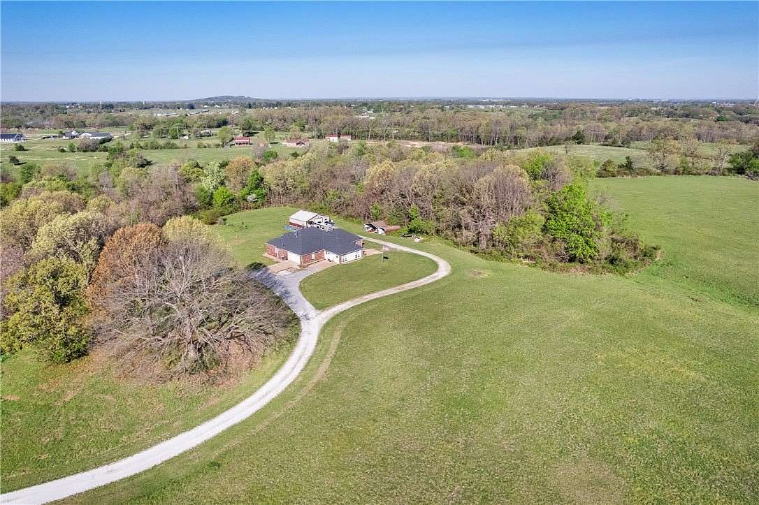 5.58 Acres of Land with Home for Sale in Lowell, Arkansas