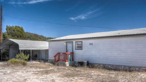 5.2 Acres of Land with Home for Sale in Camp Wood, Texas