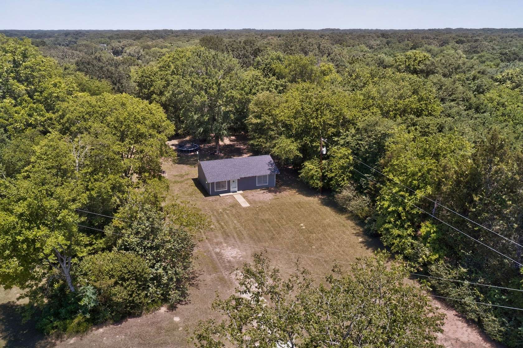 10.8 Acres of Recreational Land with Home for Sale in Emory, Texas
