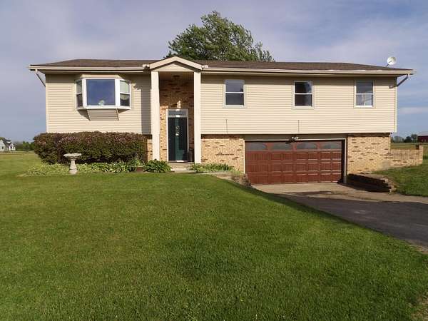 5.56 Acres of Land with Home for Sale in Casstown, Ohio
