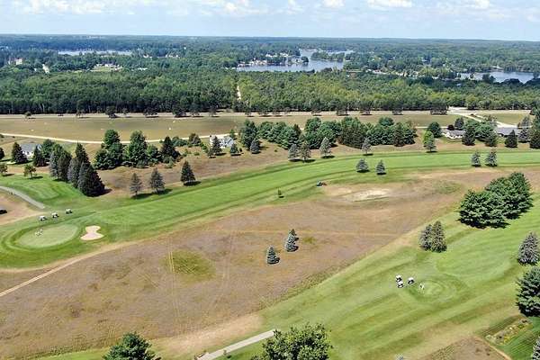 0.71 Acres of Land for Sale in Canadian Lakes, Michigan