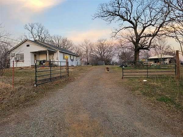 9 Acres of Residential Land with Home for Sale in Poteau, Oklahoma