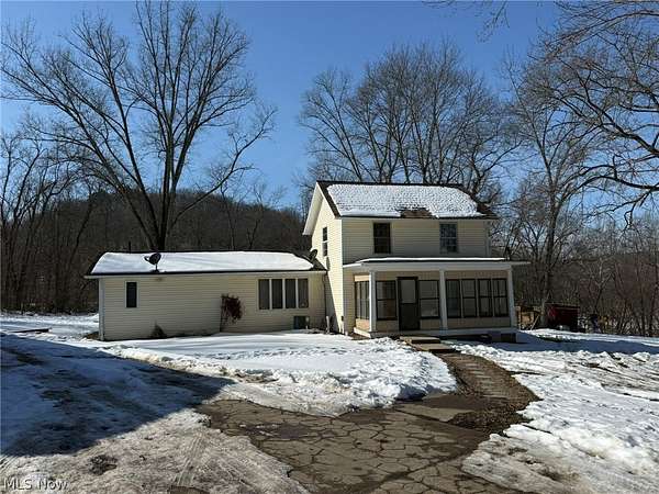 6.6 Acres of Residential Land with Home for Sale in Zoarville, Ohio