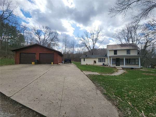 6.6 Acres of Land with Home for Sale in Zoarville, Ohio