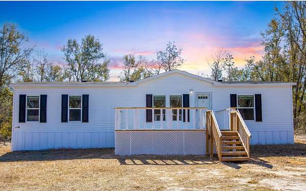 4 Acres of Residential Land with Home for Sale in Live Oak, Florida