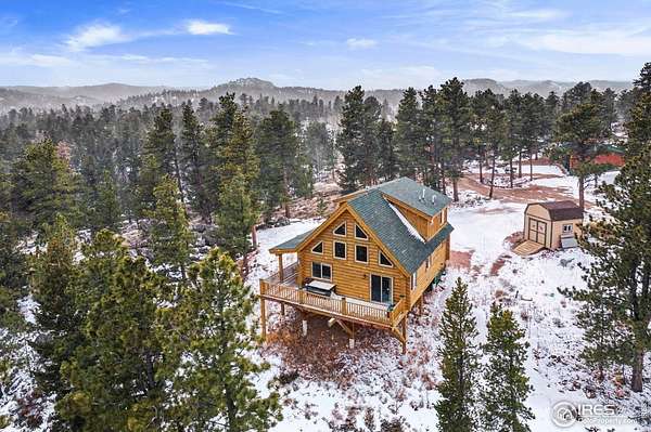 1.56 Acres of Residential Land with Home for Sale in Red Feather Lakes, Colorado