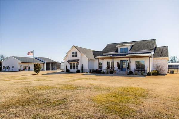 5 Acres of Land with Home for Sale in Gravette, Arkansas