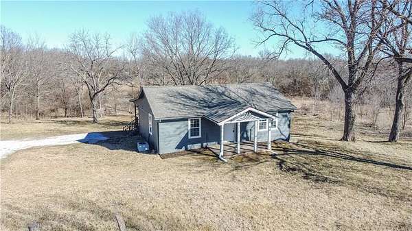 5 Acres of Residential Land with Home for Sale in Garden City, Missouri