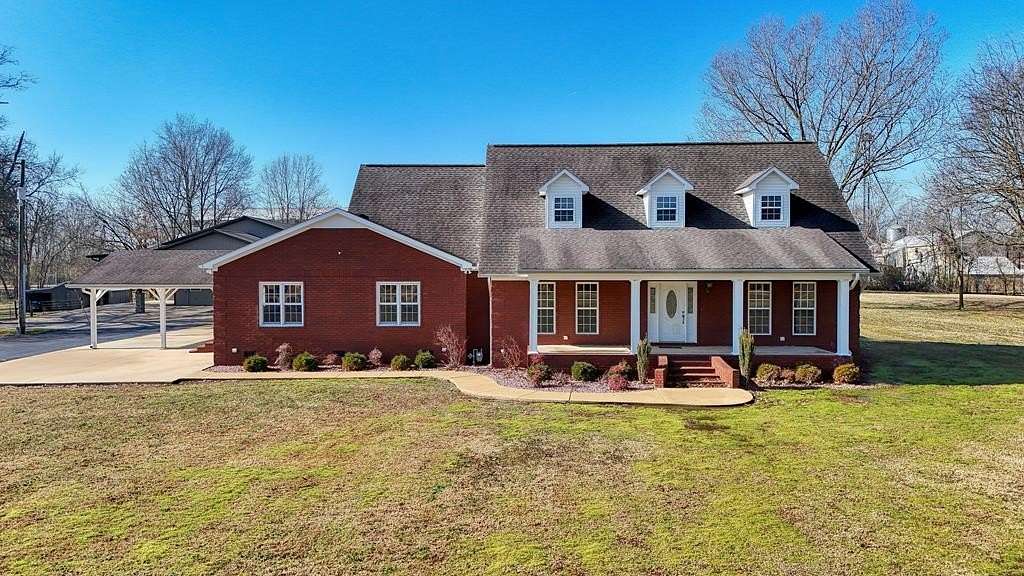 8.6 Acres of Residential Land with Home for Sale in Gleason, Tennessee