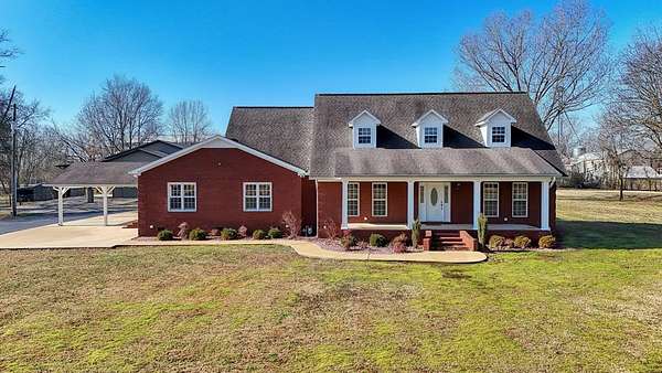 8.6 Acres of Residential Land with Home for Sale in Gleason, Tennessee