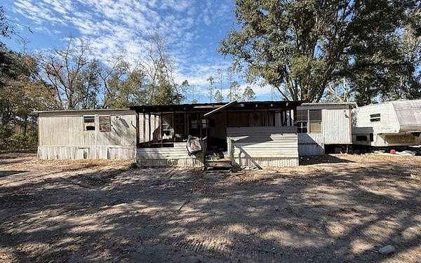 1.76 Acres of Land with Home for Sale in Live Oak, Florida