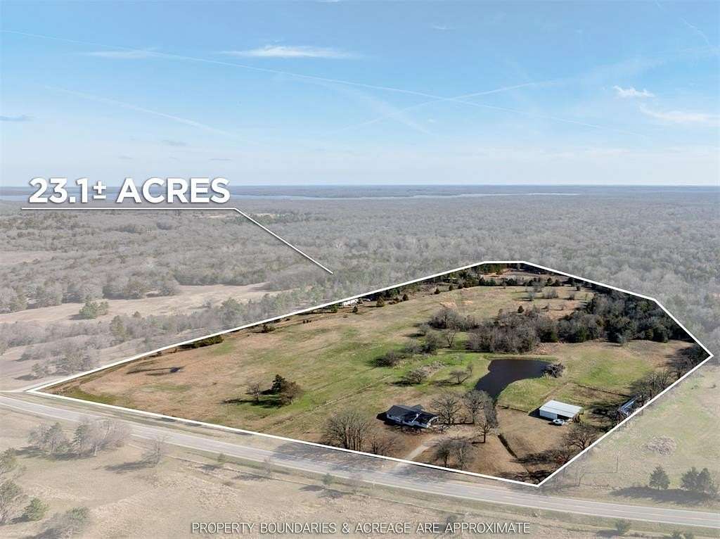 23.1 Acres of Land with Home for Sale in Arthur City, Texas