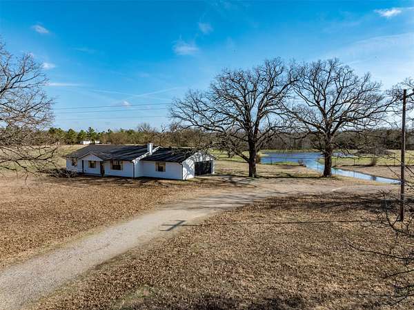 23.1 Acres of Land with Home for Sale in Arthur City, Texas