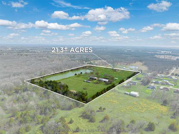21 Acres of Agricultural Land with Home for Sale in Powderly, Texas