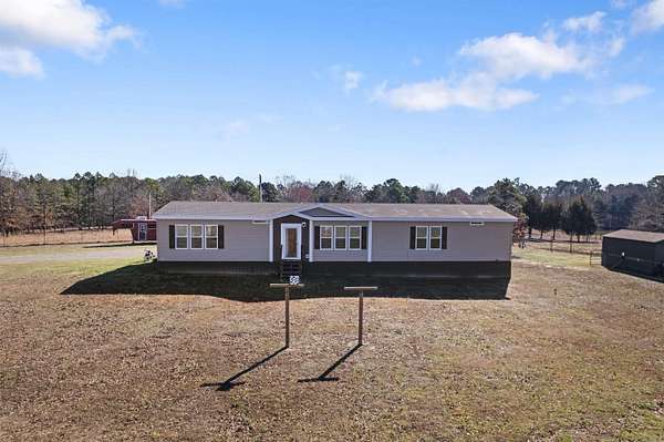 10 Acres of Land with Home for Sale in Romance, Arkansas