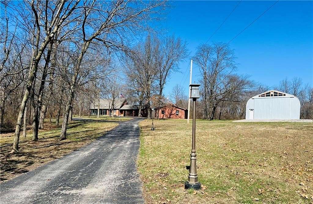 7.77 Acres of Land with Home for Sale in Oak Grove, Missouri