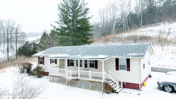 6 Acres of Land with Home for Sale in Rocky Top, Tennessee