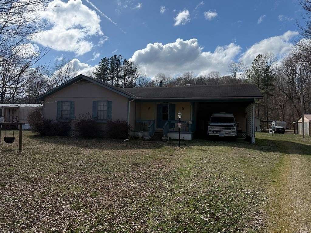 5 Acres of Land with Home for Sale in Big Sandy, Tennessee