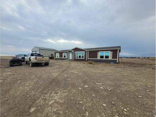 10 Acres of Land with Home for Sale in Briggsdale, Colorado
