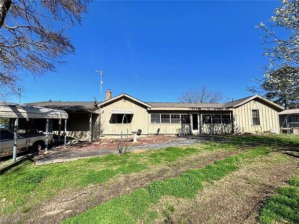 7.44 Acres of Land with Home for Sale in Booneville, Arkansas